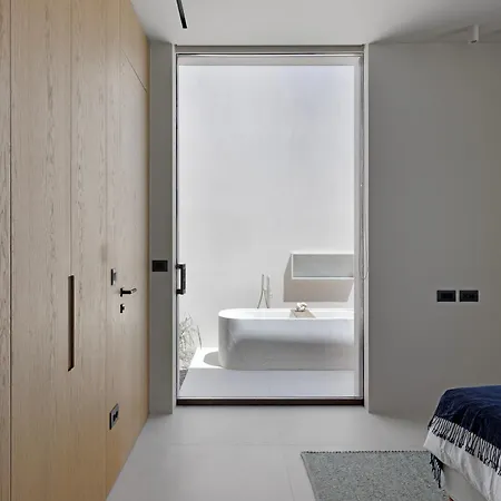 Celestia Cove, Earthy Architecture Meets Endless Blue By Etouri Villa